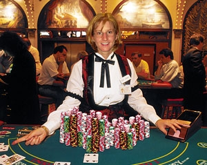 A Bally's blackjack dealer shows off a tiny portion of the casino's winnings.